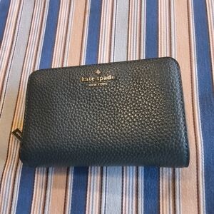 kate spade pebbled leather zip wallet in dark teal with gold logo